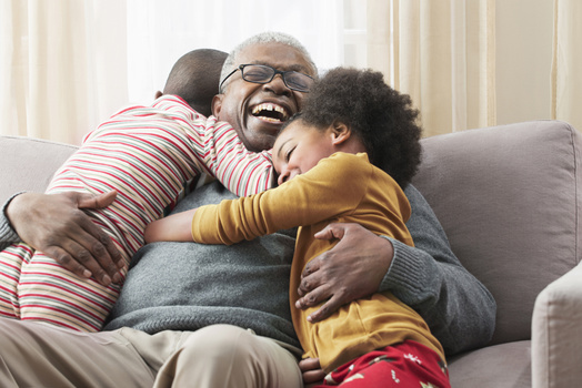 Happ grandfather with 2 grandchildren