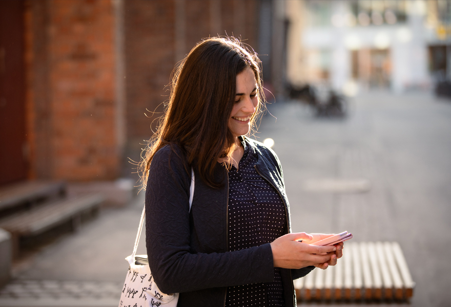 Woman with phone smiling Woman with phone smiling