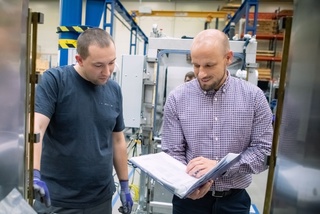 Men during work discussing