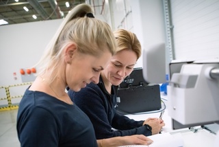 Women in work smiling