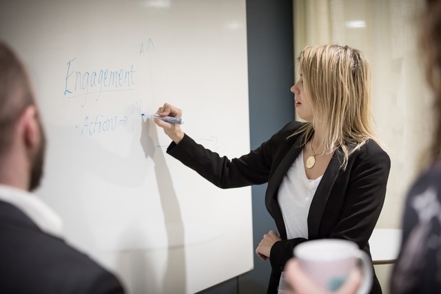 Woman writing on the whiteboard