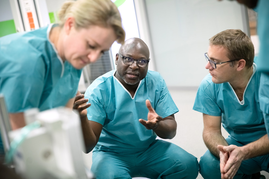 Doctors gathered discussing Doctors gathered discussing