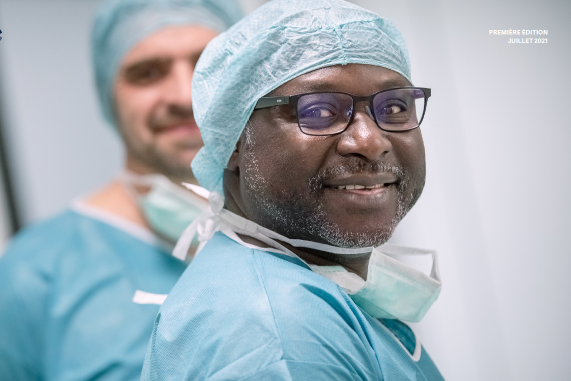 Doctor in the surgery apron smiling Doctor in the surgery apron smiling