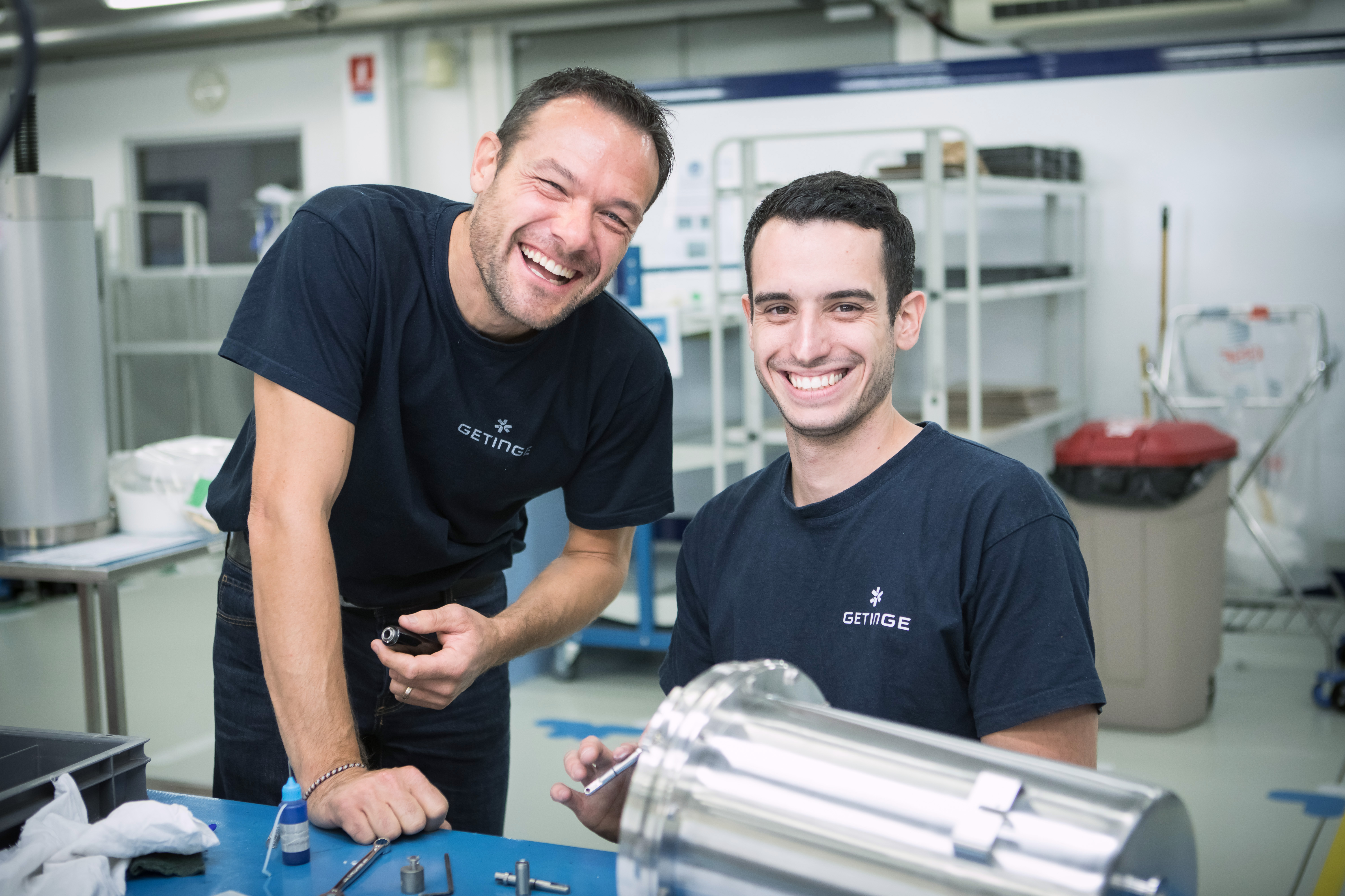 Men in the warehouse smiling Men in the warehouse smiling