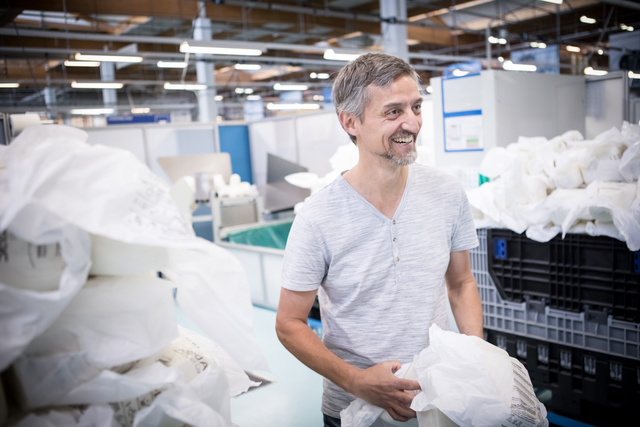 Man smiling in the warehouse