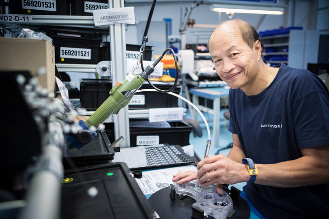 Man smiling and mounting LED