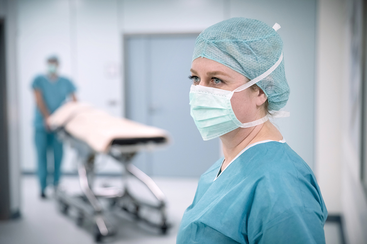Nurse with a mask and a medical cap Nurse with a mask and a medical cap