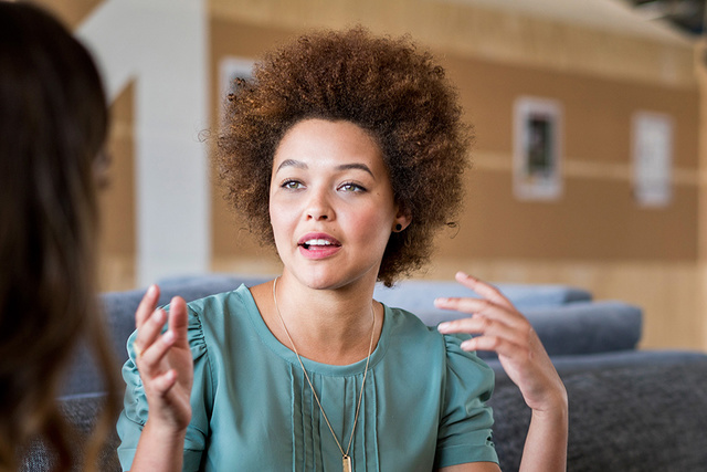 Woman with afro hair explaining