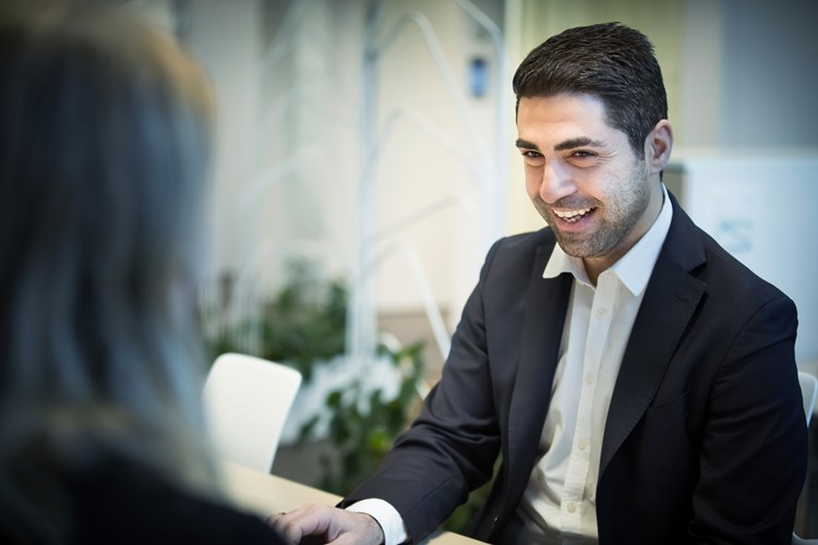 Man smiling during conversation Man smiling during conversation