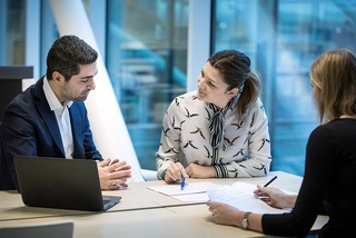 People on a meeting discussing