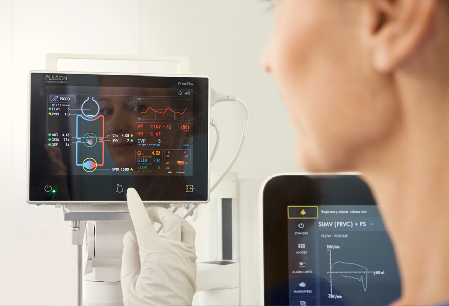 Nurse with gloves monitoring Nurse with gloves monitoring