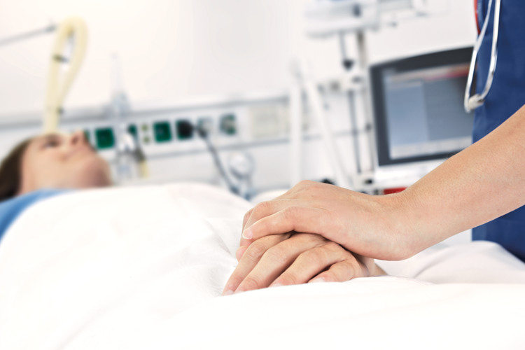 Nurse holding patients hand Nurse holding patients hand