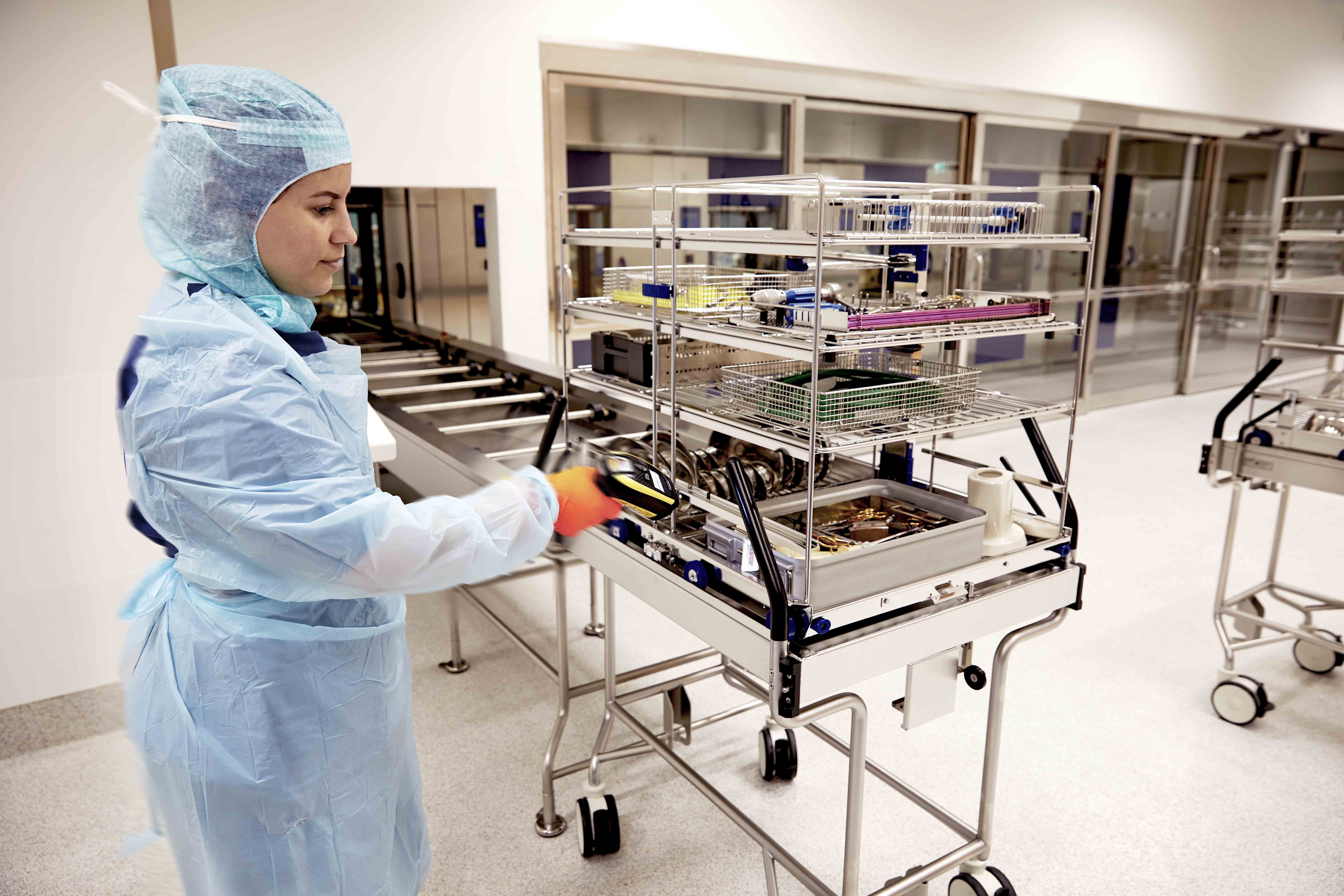 CSSDs technicians fast-tracking trays and instruments to ensure on-time delivery for surgeries CSSDs technicians fast-tracking trays and instruments to ensure on-time delivery for surgeries