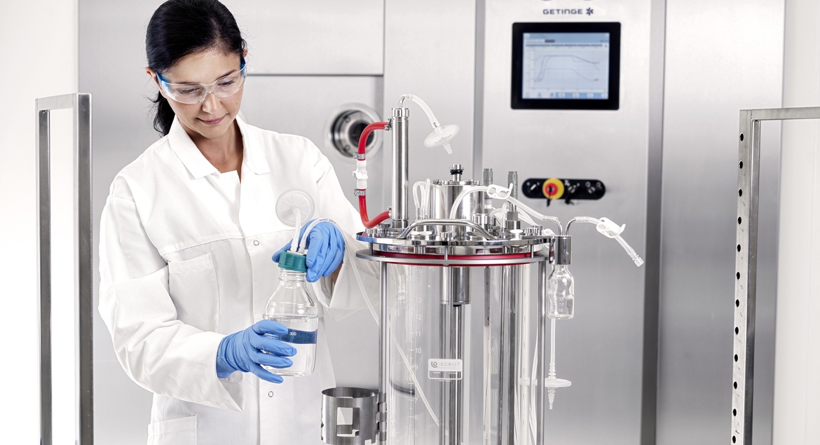 Woman working on a multi use bioreactor 