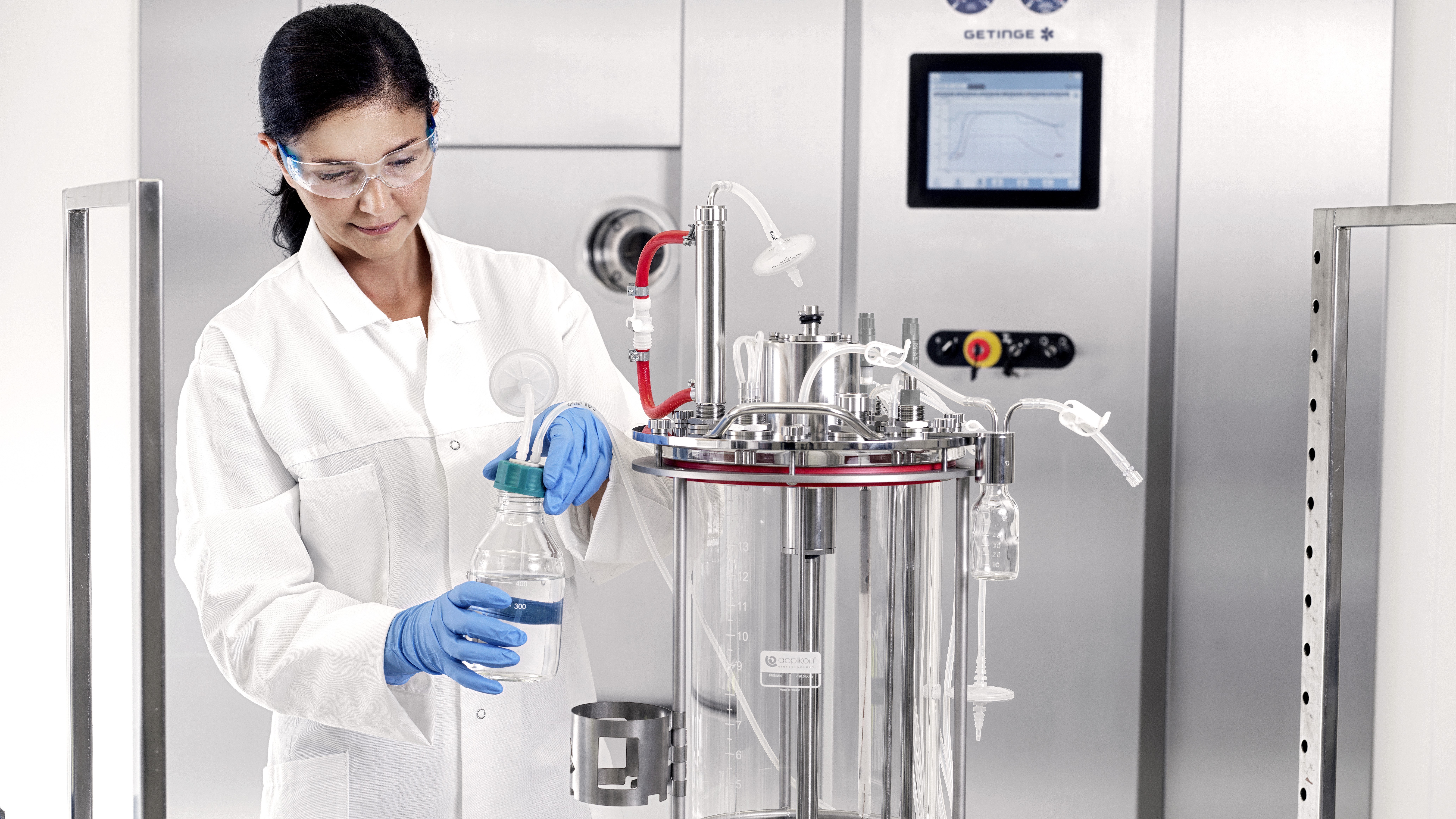 Woman working on a multi use bioreactor 