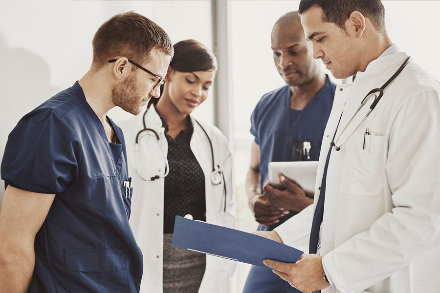 Doctors looking at a document Doctors looking at a document
