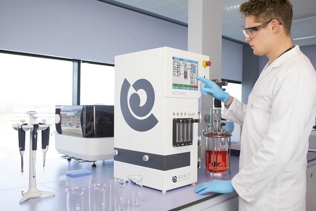 Scientist with Applikon ez2-Control in lab