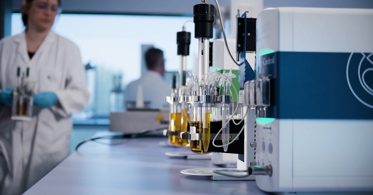 Scientist in lab with minibio Scientist in lab with minibio