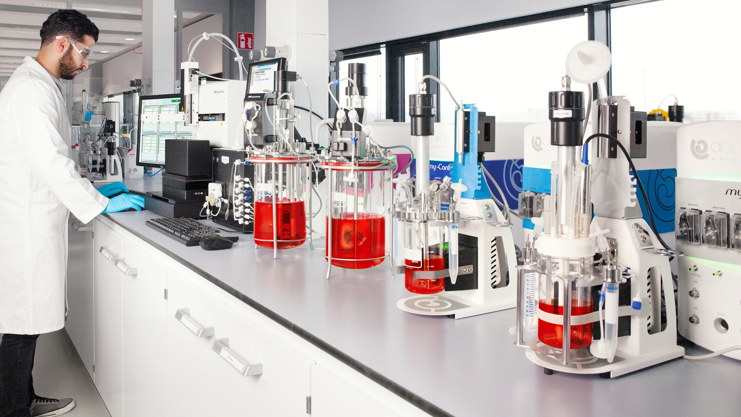 Scientist in lab running cultivations Scientist in lab running cultivations