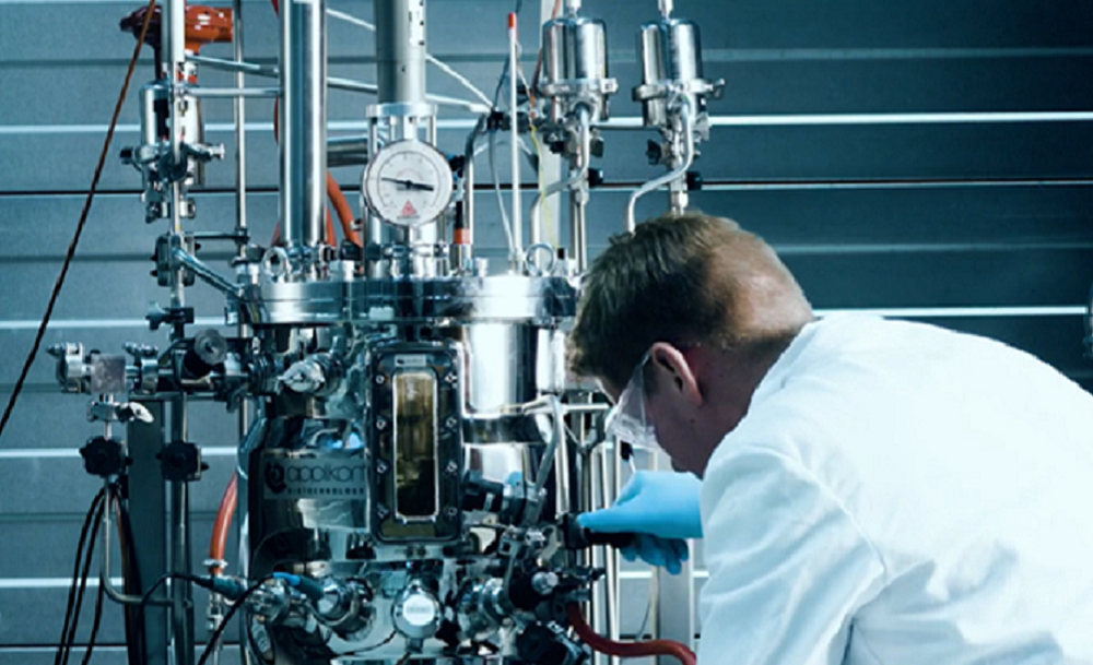Operator with stainless steel bioreactor Operator with stainless steel bioreactor