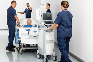 Four nurses and one patient under Cardiosave IABP Hybrid in the hallway