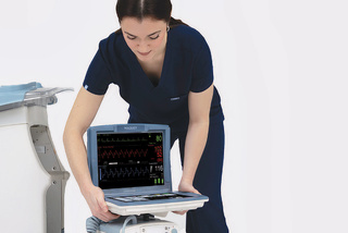 Woman placing Cardiosave IABP hybrid  monitor on rescue 