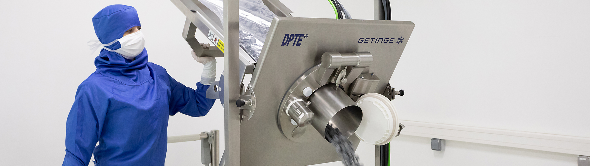 An operator transferring components using the DPTE-EXO automated transfer port An operator transferring components using the DPTE-EXO automated transfer port
