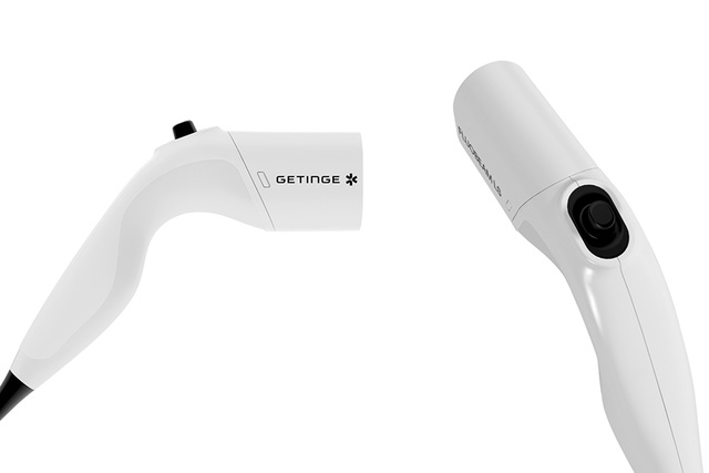 Fluobeam LS handheld near‑infrared fluorescence imaging camera by Getinge, front and rear views on white background.