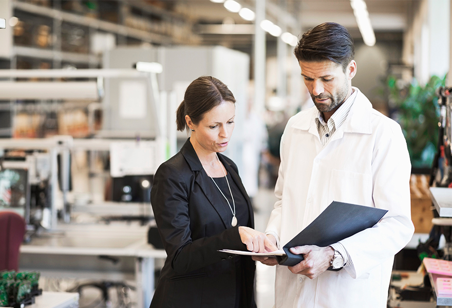 Businesswoman and engineer discussing Businesswoman and engineer discussing