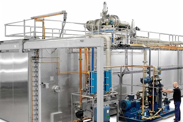 GEE Ethylene Oxide sterilizer with a man working next to it