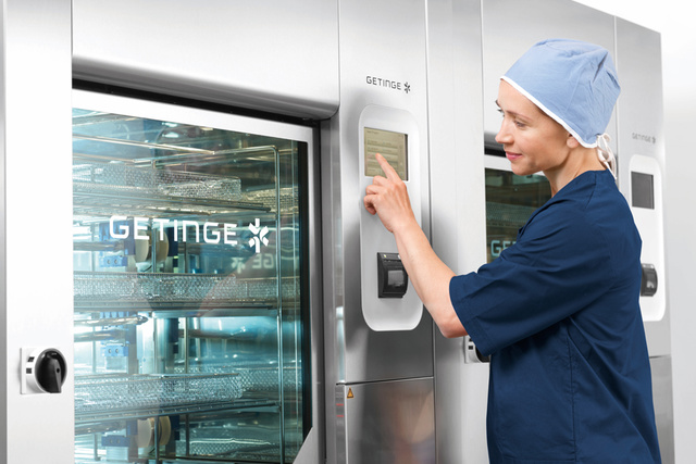 nurse monitoring the Getinge 86-Series disinfector