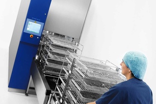 A  multi-chamber pass-through washer disinfector for up to 15 DIN trays