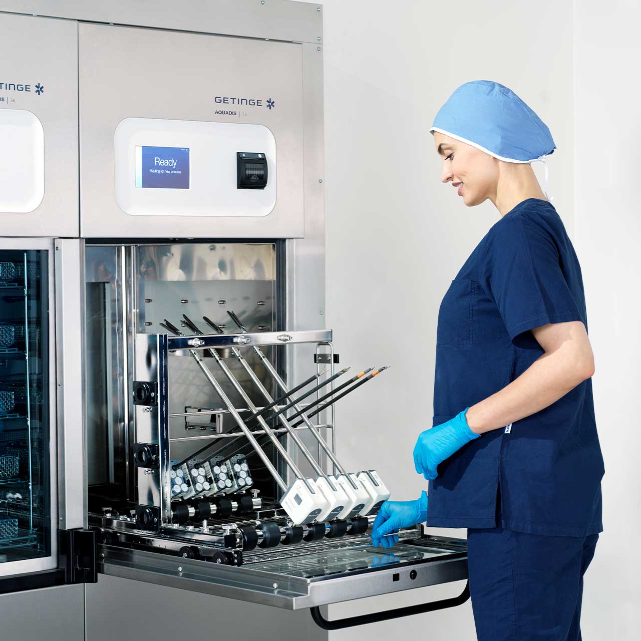 Da Vinci Xi surgical instruments loaded into a Getinge Aquadis 56 Washer-Disinfector 