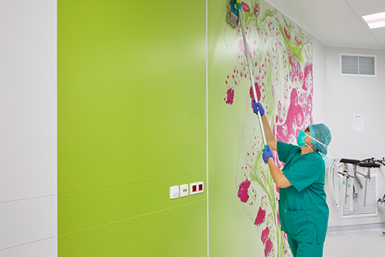 Woman cleaning a wall Woman cleaning a wall