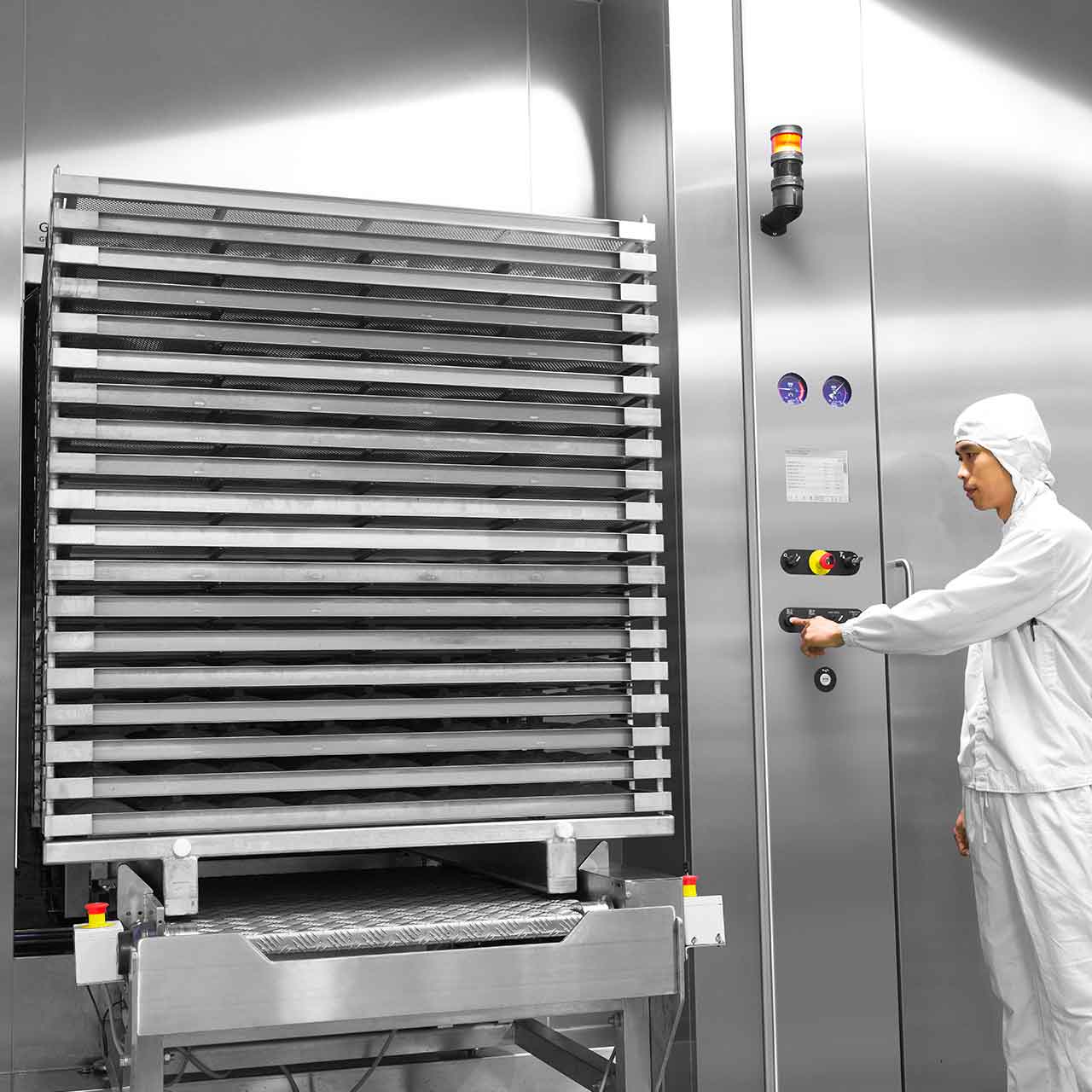 GEV Steam/Air Mixture Sterilizer with biopharma at customer site with a man working next to it