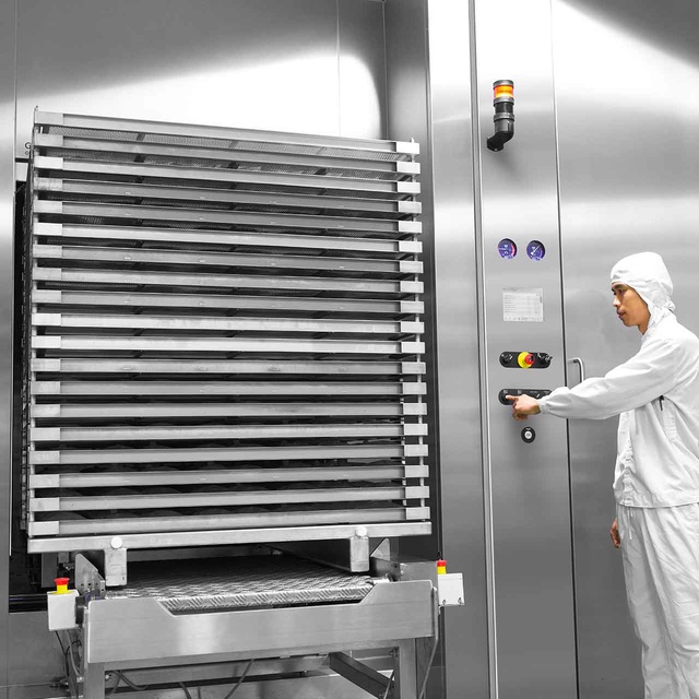 GEV Steam/Air Mixture Sterilizer with biopharma at customer site with a man working next to it