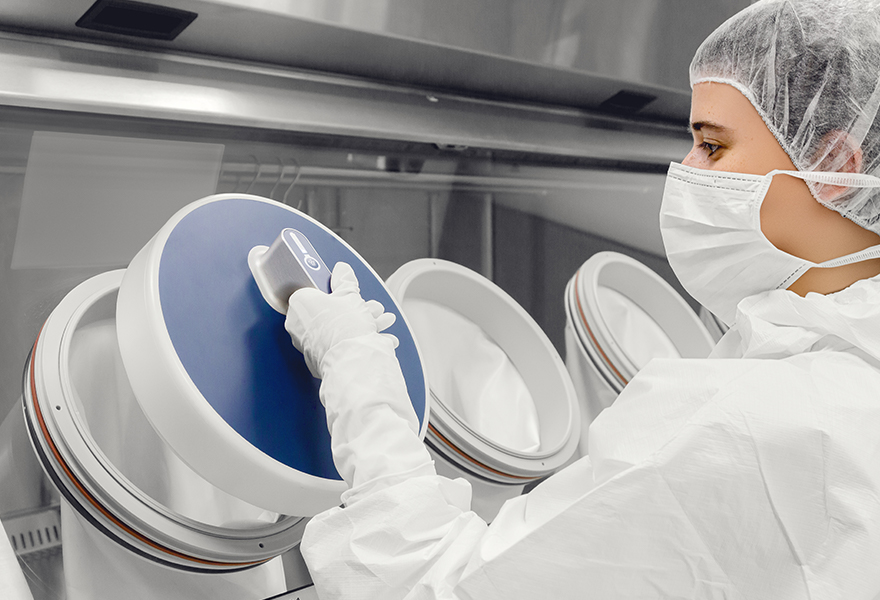 An operator using a Glove Leak Tester to test the isolator glove and sleeve integrity An operator using a Glove Leak Tester to test the isolator glove and sleeve integrity