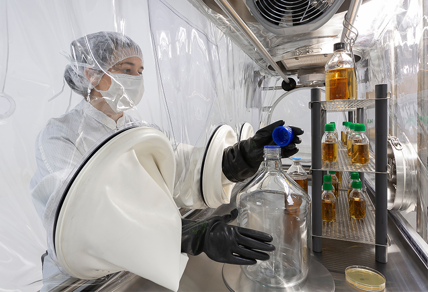Operator working in a 4-glove softwall ISOFLEX-S isolator Operator working in a 4-glove softwall ISOFLEX-S isolator