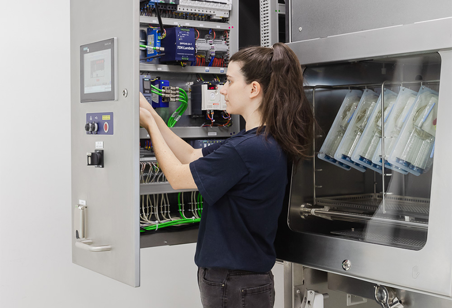 Maintenance technician working in an ISOPRIME isolator Maintenance technician working in an ISOPRIME isolator