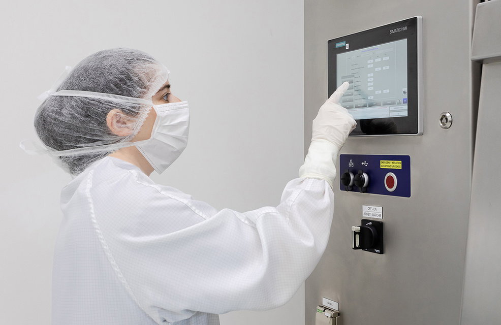 Operator using the ISOPRIME isolator's HMI