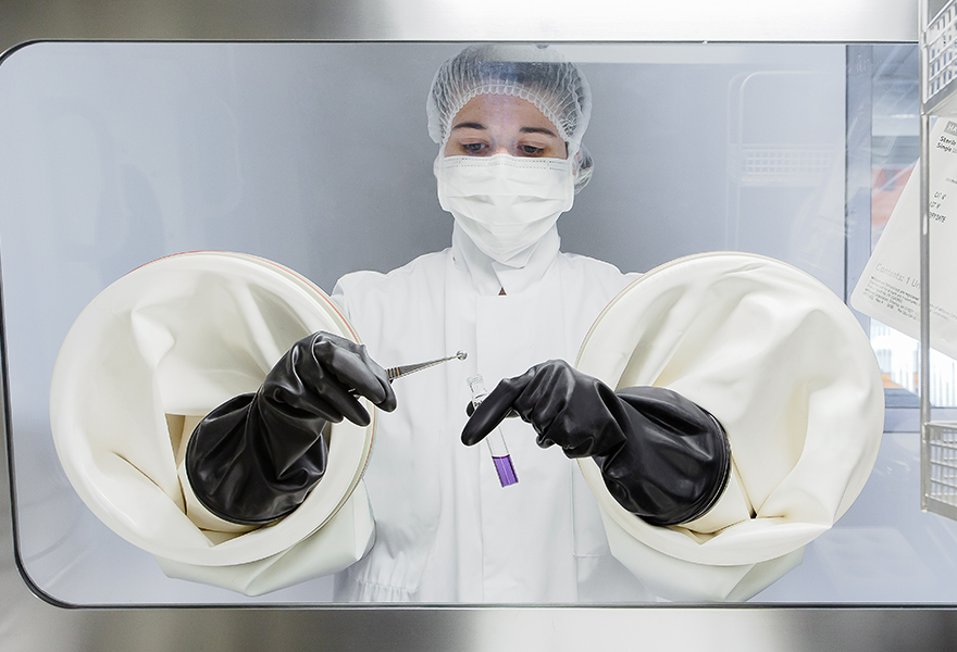 Operator performing aseptic manipulation in an ISOTEST isolator Operator performing aseptic manipulation in an ISOTEST isolator