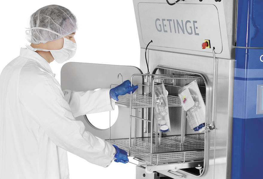 An operator loading the ISOTEST's hatch