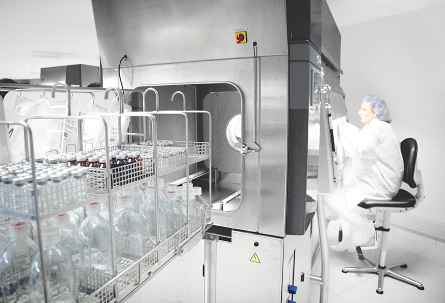 An operator working in the ISOTEST isolator An operator working in the ISOTEST isolator