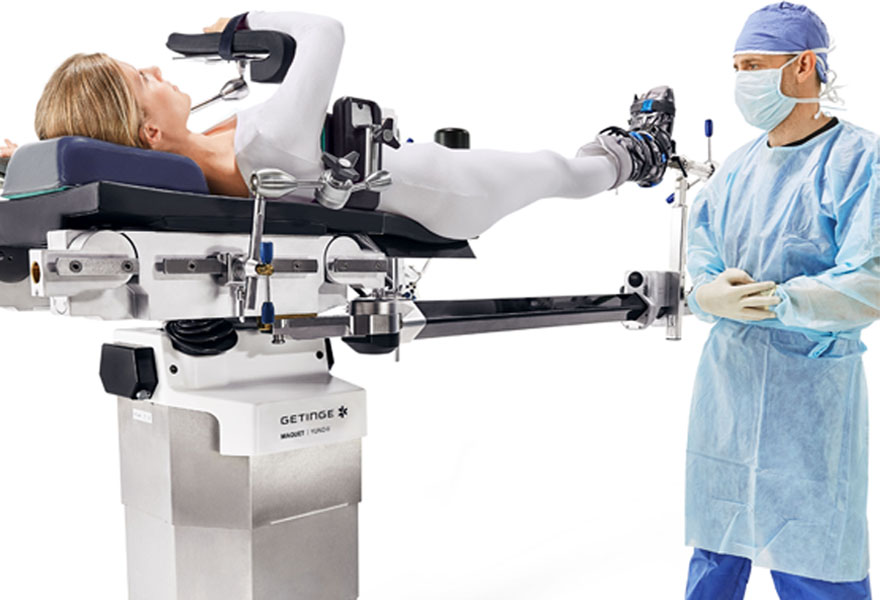 Doctor monitoring the Yuno II with patient lying on it Doctor monitoring the Yuno II with patient lying on it