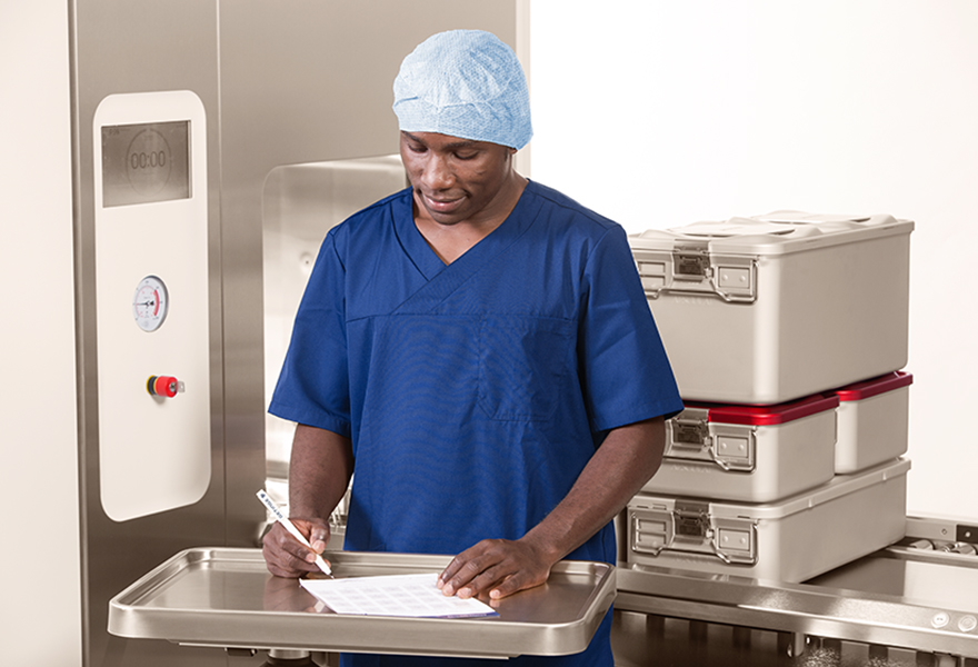 Sterile assistant filling in Meditrax sterilizer record Sterile assistant filling in Meditrax sterilizer record