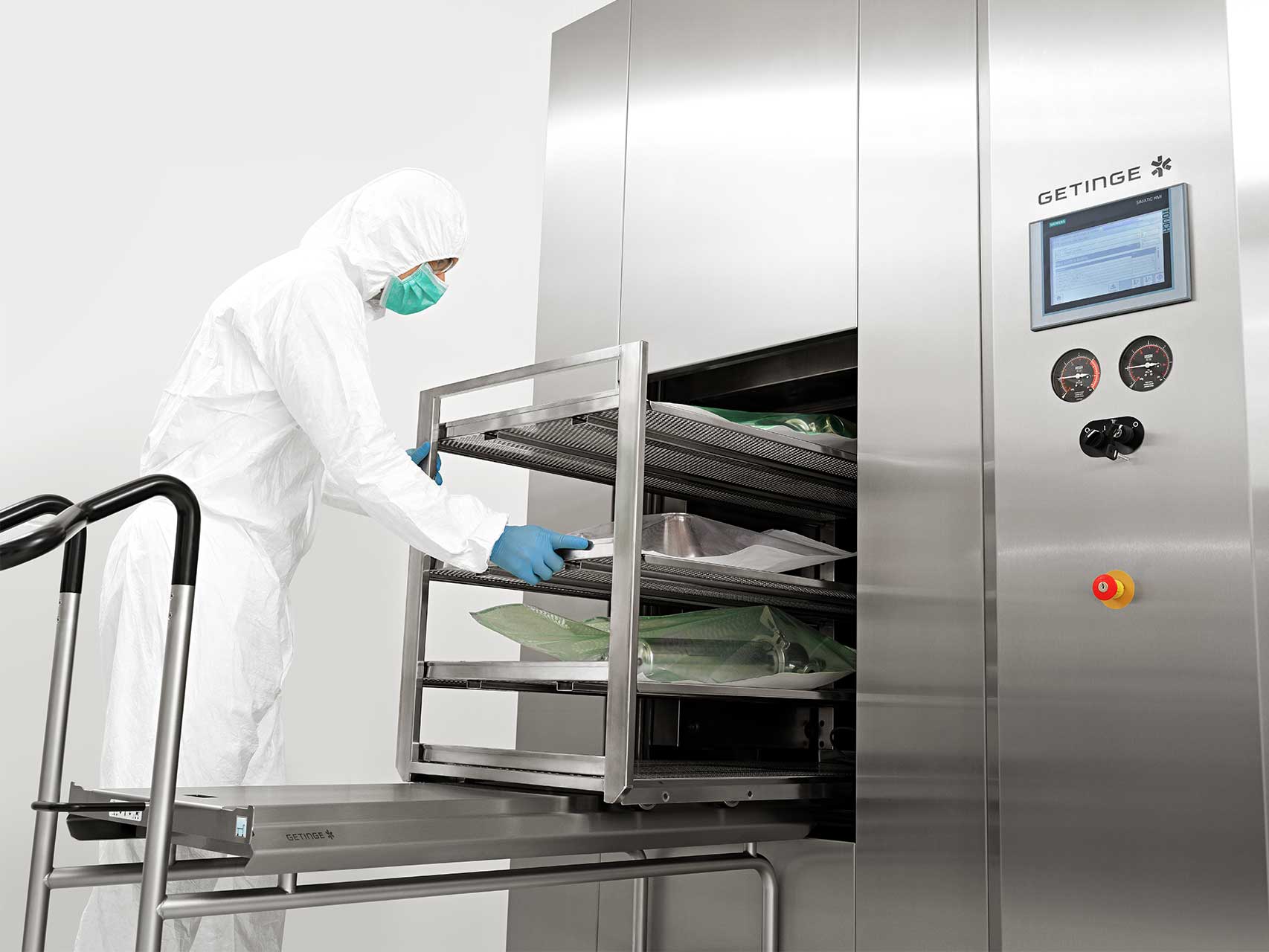 A man is loading the GSS Steam Sterilizer with equipment for biopharmaceutical production A man is loading the GSS Steam Sterilizer with equipment for biopharmaceutical production