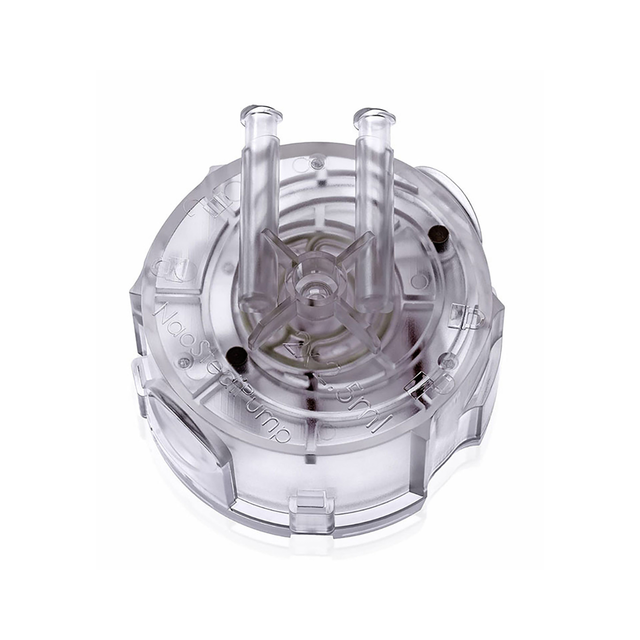 Close-up of the clear, circular, single-use fluid cartridge for the Swissinnov NaoStedi Piston Pump.