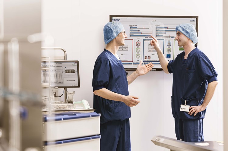Doctors discussing workflow Doctors discussing workflow