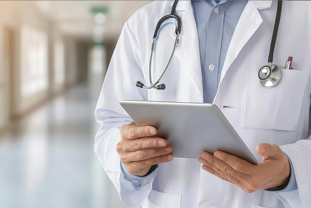 Physician holding tablet