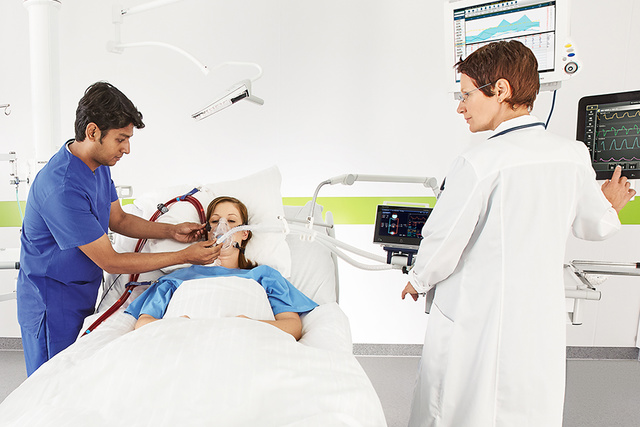 ECMO patient in ICU bed with clinicians 